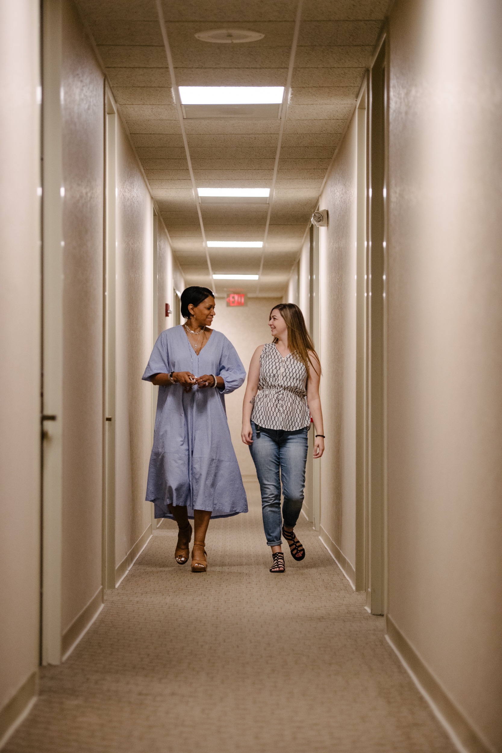 two arkana team members walking down hall and talking Careers at Arkana Laboratories