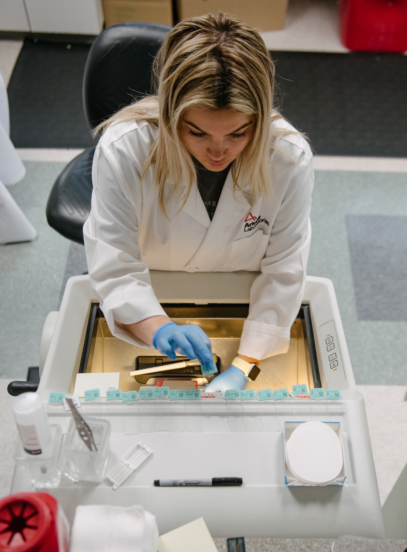 lab technician cutting a renal biopsy at IF station