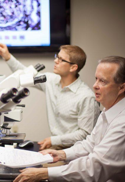 Dr. Walker teaching Dr. Larsen about renal pathology in early days