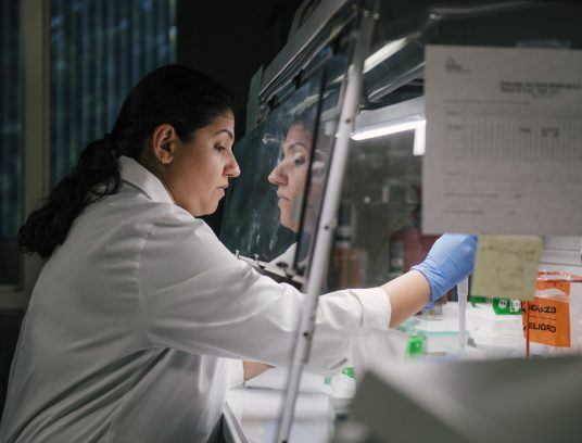 physician at arkana laboratories working in research lab