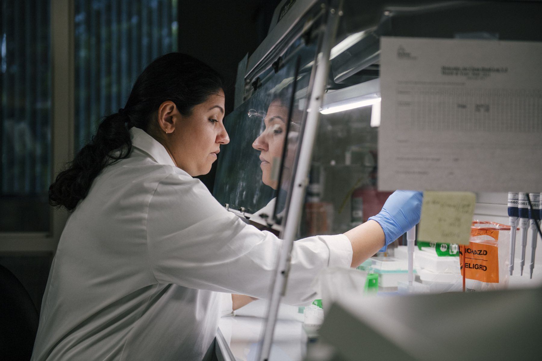 physician at arkana laboratories working in research lab