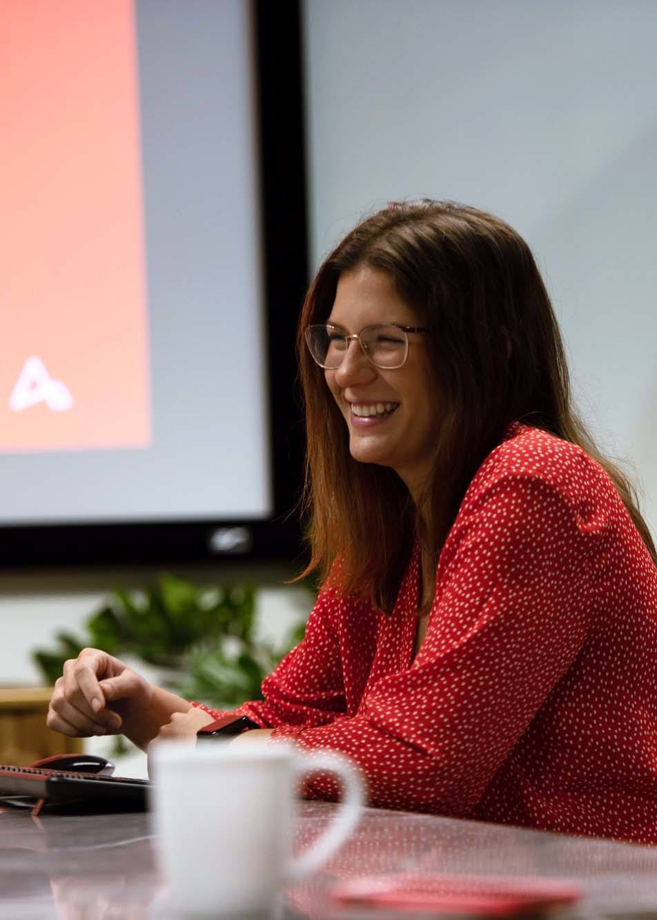 arkana team member smiling during a meeting careers at Arkana Laboratories