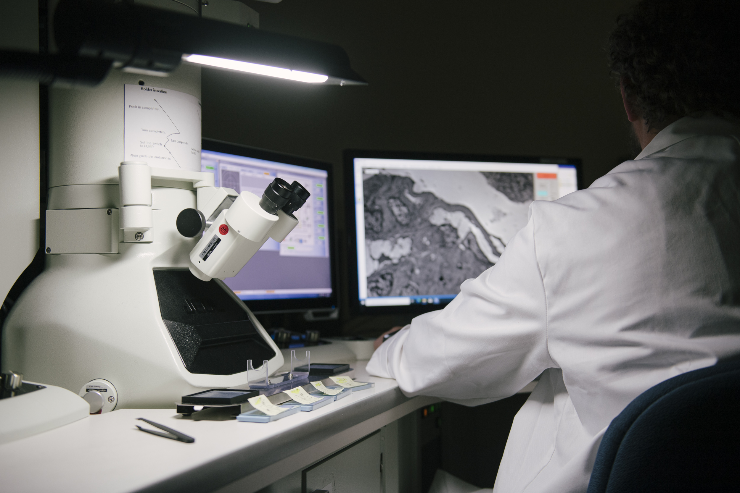 EM lab technician at Arkana Laboratories scoping a renal biopsy