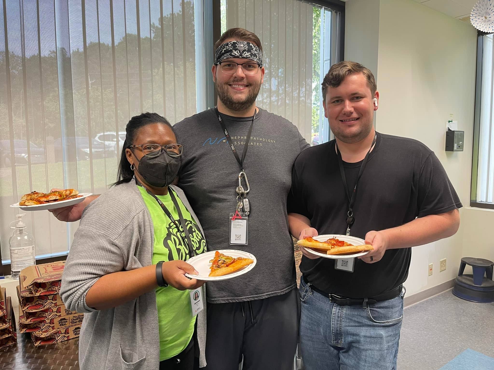 Lab team with pizza