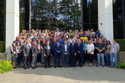 all of Arkana staff taking photo with AEDC, Gov hutchinson, and Little Rock Mayor Frank Scott Jr